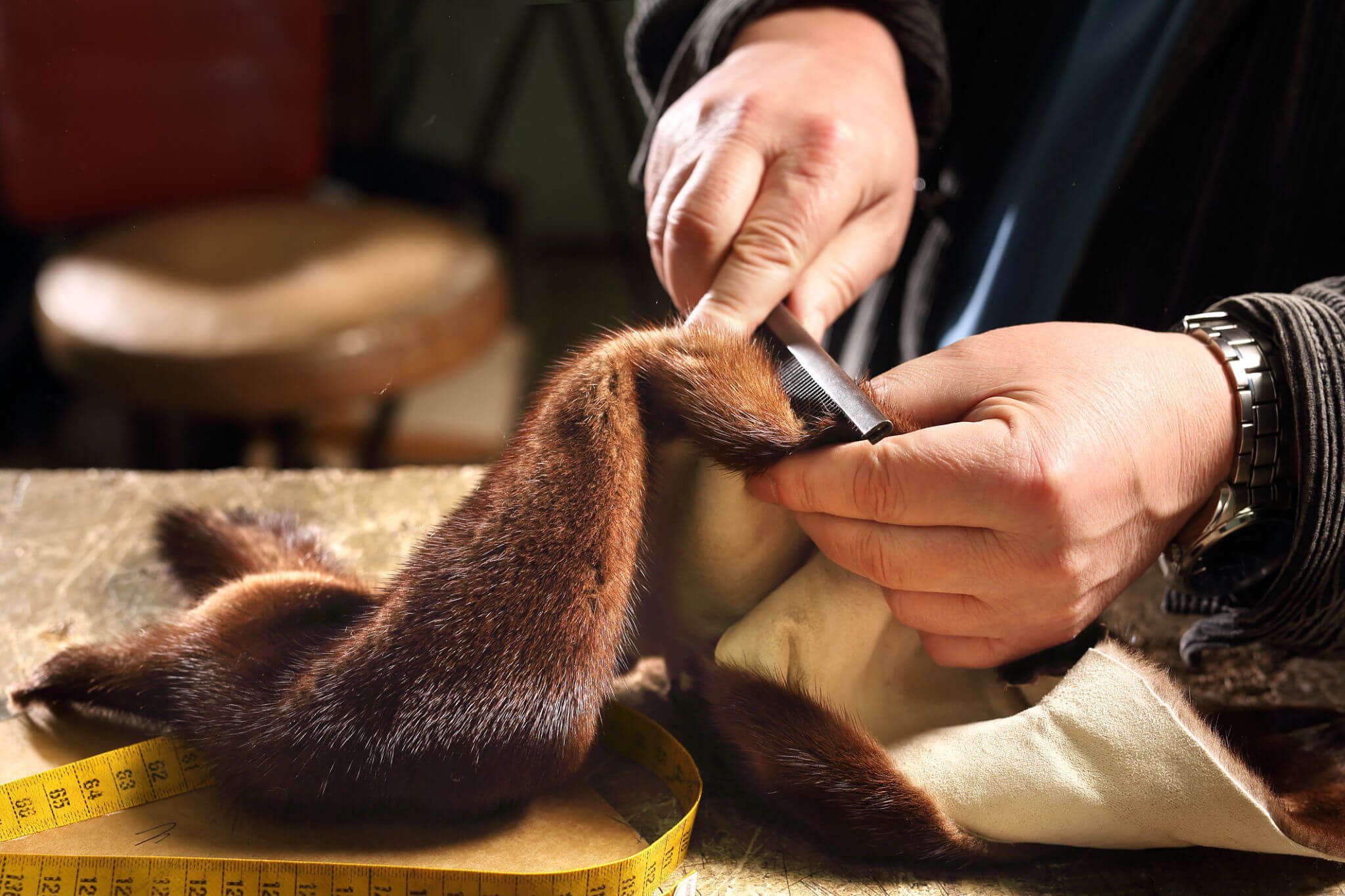 Artisan working on fur material